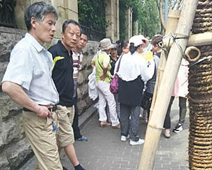 Supporters of democracy activists wait outside Zhejiang courthouse