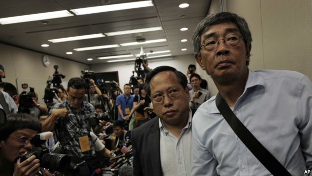 Freed Hong Kong bookseller Lam Wing-kee, right, is accompanied by pro-democracy lawyer Albert Ho after giving a news conference in Hong Kong