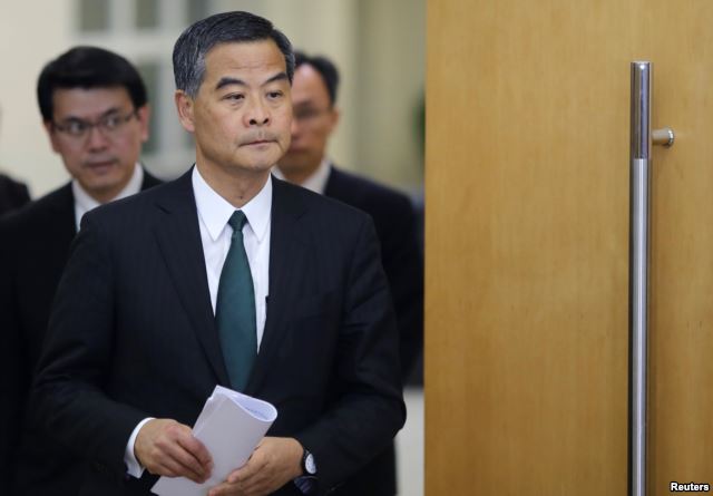 Hong Kong Chief Executive Leung Chun-ying arrives at a news conference