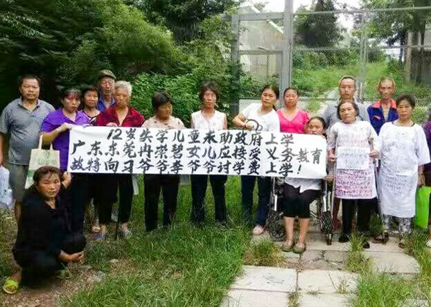 Petitioners whose children have been been denied access to school protest in Beijing