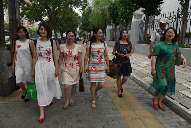 wives-of-chinese-human-rights-lawyers-detained-in-a-2015-crackdown-wearing-the-names-of-their-husbands