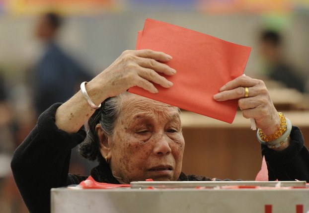 an-elderly-woman-casts-her-vote-in-a-local-election-in-china