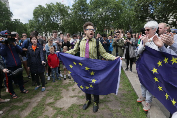 Demonstrators opposing Britain's exit from the European Union in Parliament Square following yesterday's EU referendum result, London, Saturday, June 25, 2016. Britain voted to leave the European Union after a bitterly divisive referendum campaign. (AP Photo/Tim Ireland)