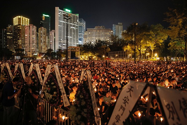 Tens of thousands of people attend a candlelight vigil at Victoria Park in Hong Kong, Saturday, June 4, 2016 to commemorate victims of the 1989 military crackdown in Beijing. China's bloody 1989 military crackdown on the Tiananmen Square pro-democracy protests was a pivotal moment in the country's political development. Despite the Communist Party's efforts to erase memories of the event, every year its anniversary triggers heightened security and surveillance on the mainland, along with furtive commemorations by a handful of activists. (AP Photo/Kin Cheung)