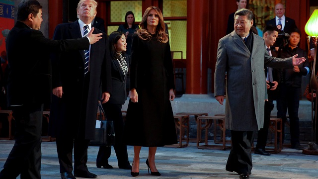 U.S. President Donald Trump and first lady Melania enjoy an opera performance with China's President Xi Jinping at the Forbidden City in Beijing, China, November 8, 2017. REUTERS/Jonathan Ernst